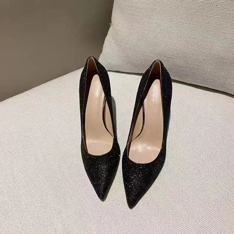 Women's silver and black stiletto wedding shoes with crystal details on a PU leather upper