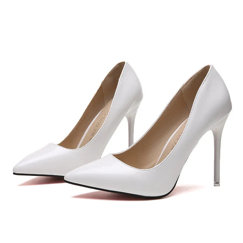 Women's pointed toe high heel pump with a stiletto heel above 8cm, shown in a nude colour with a buckle detail.