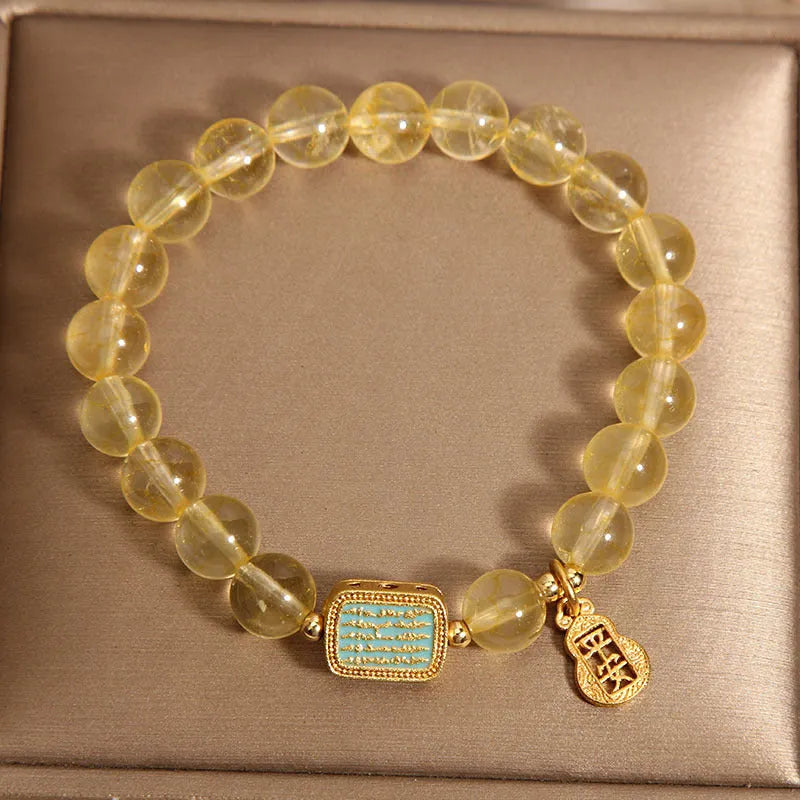 Women's natural yellow crystal bracelet with citrine colour tones and rhinestone decorative elements
