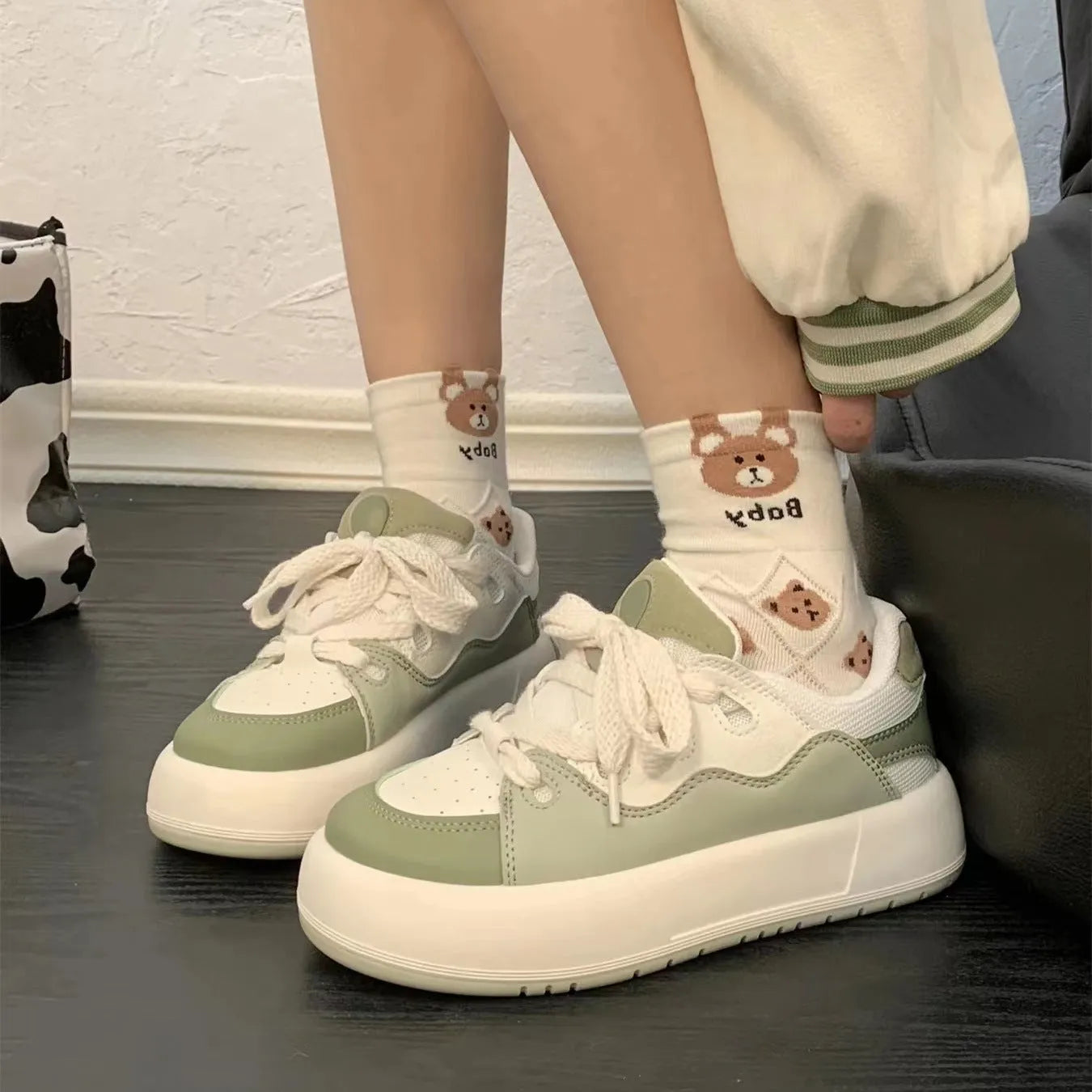 Green women's casual shoes with mesh upper, round toe, and flat non-slip sole.