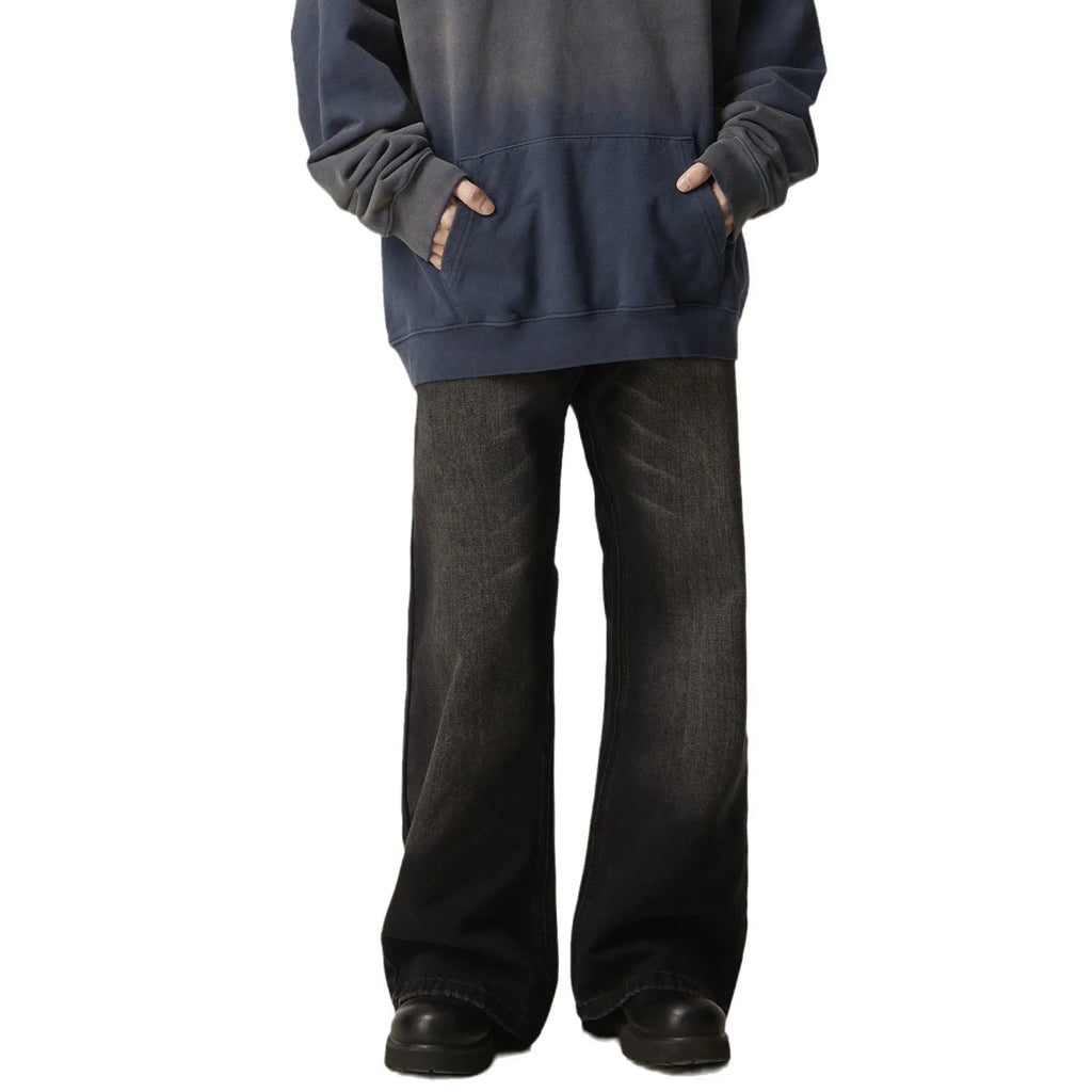 Black loose-fit straight-leg men's jeans with a zipper fly and retro styling.