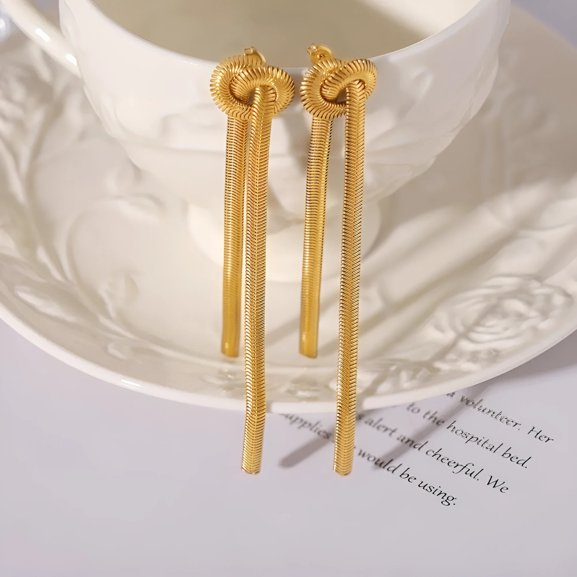 Gold knotted tassel necklace and matching earrings set with snake chain