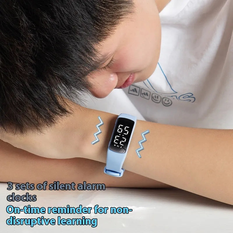 Vibration alarm smart watch with coloured silicone strap and LED display on wrist