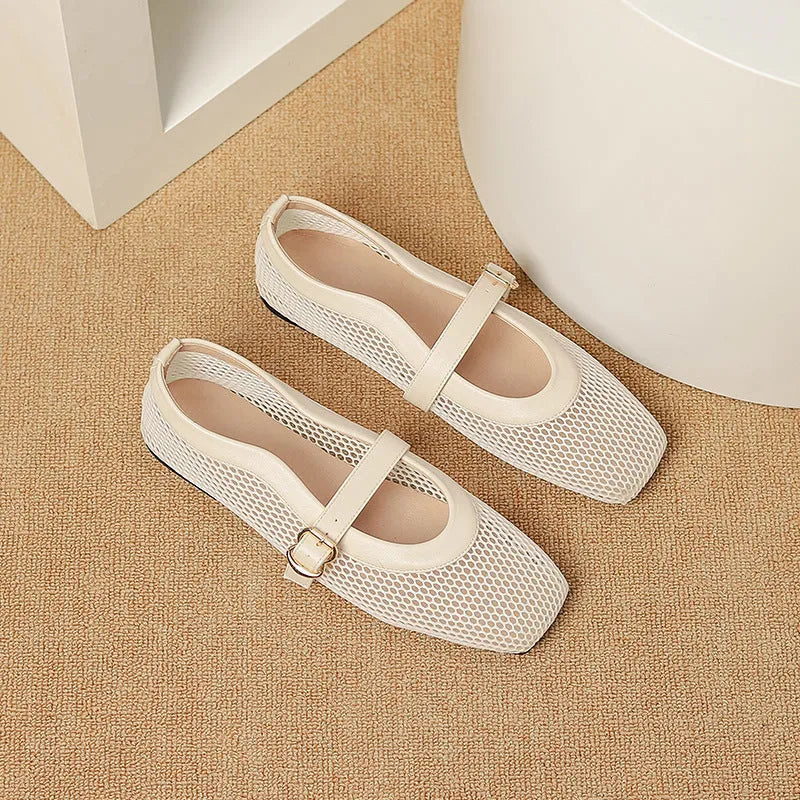 Women's beige mesh low heel pump with a buckle strap and square toe on a neutral background.