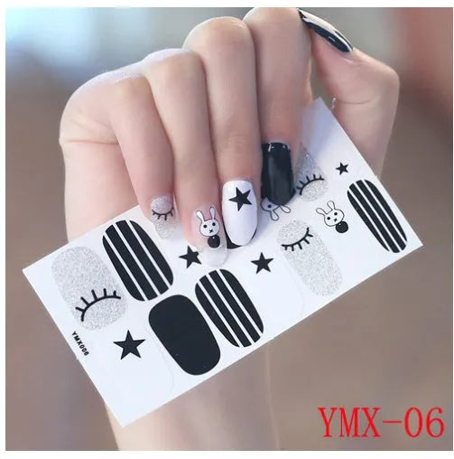 Full nail stickers set of 14 sheets showing 16 colour options in a flat lay arrangement