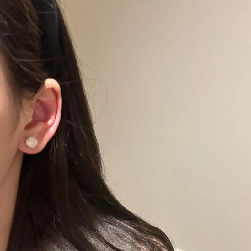 Chinese style chalcedony stud earrings with geometric design and claw setting