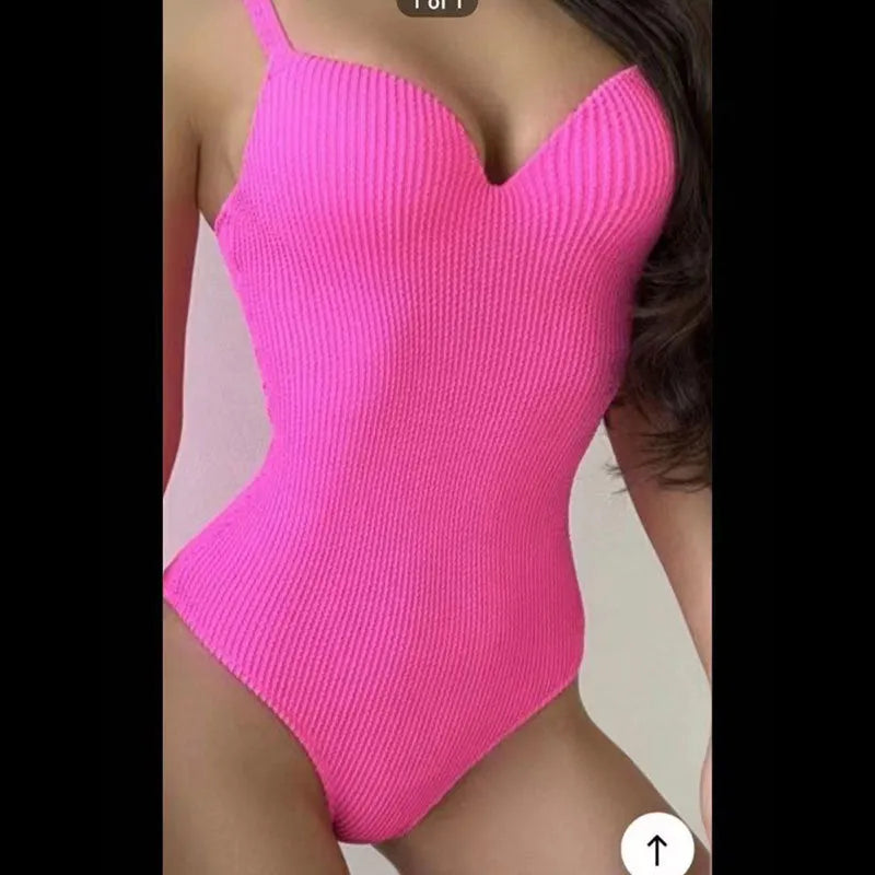 Women's black sunk stripe one-piece swimsuit made from polyester, shown on a mannequin.