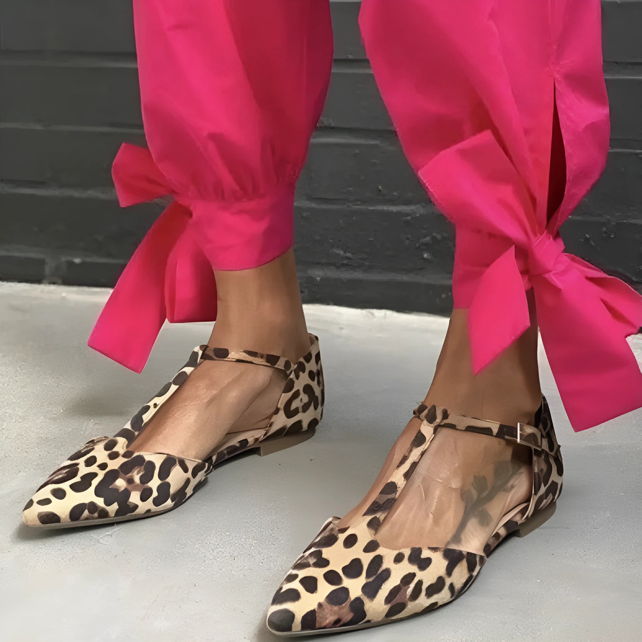 Leopard print women's pumps with pointed toe and chunky low heel, featuring cross shoulder straps