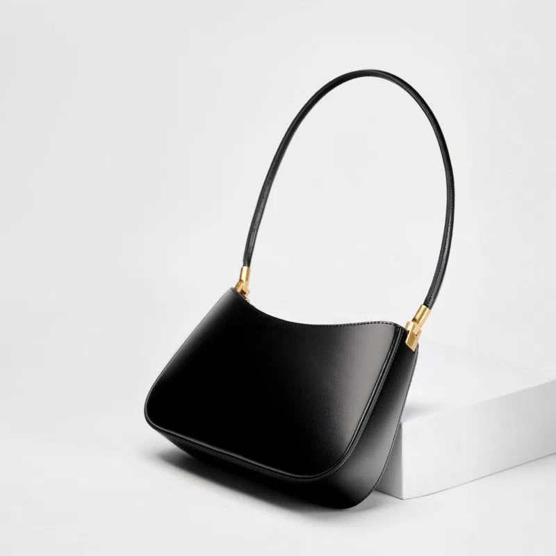 Women's casual French-style oval one-shoulder bag in cowhide leather, 25.5x6x14cm, available in black