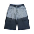 Blue tie-dye gradient washed-out cropped jeans with loose fit and worn looking finish
