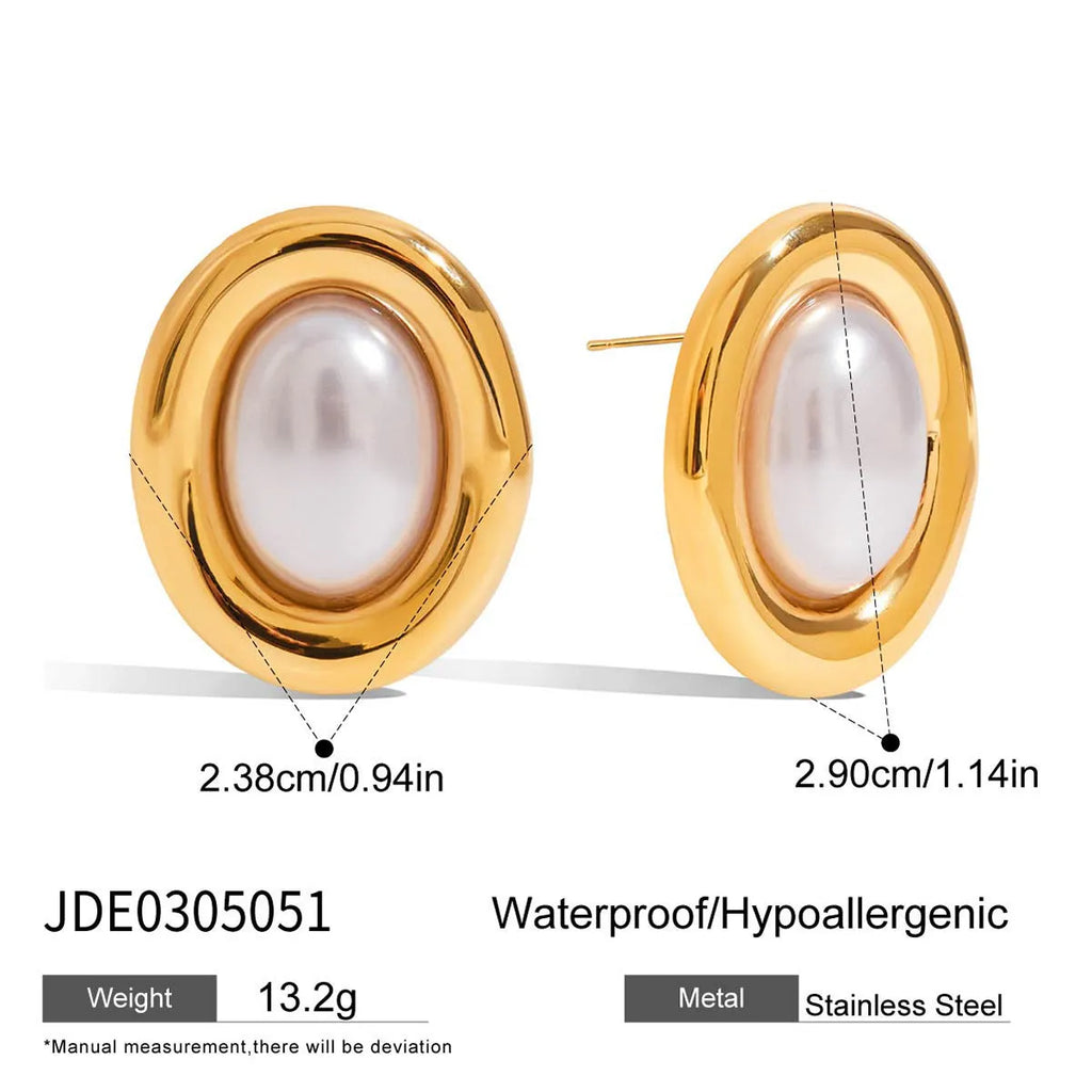Close-up of women's stainless steel vintage pearl stud earrings with a silver-toned electroplated finish.