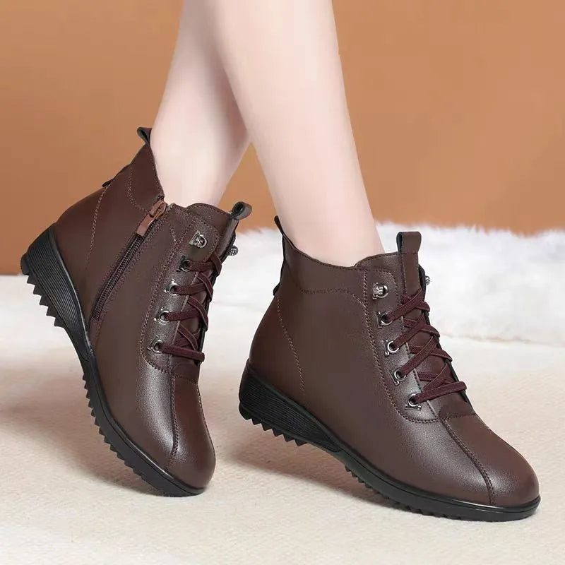 Women's casual shoes in black artificial PU with mid heel, side zipper, and round toe on light background