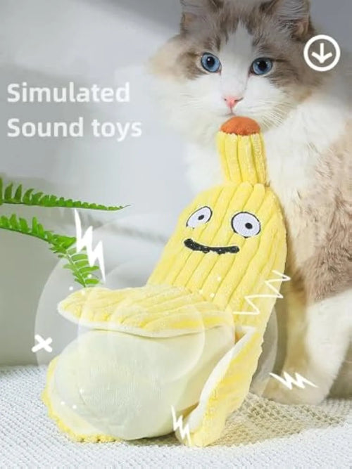 Yellow banana-shaped plush cat toy with a textured velvet strip, shown next to a cat for scale.