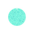 A blue silicone pet licking mat with a suction cup base on a kitchen floor.