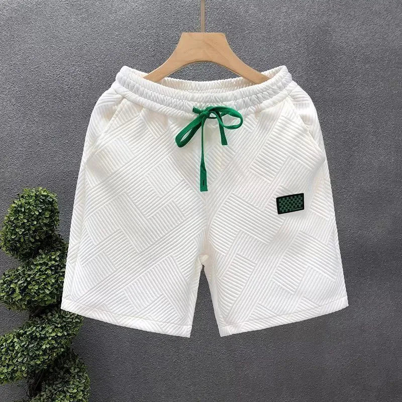Casual solid-colour polyester sports shorts with micro elasticity on a mannequin.
