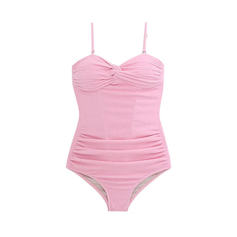 Black women's suspender-style high-waist one-piece swimsuit on a model