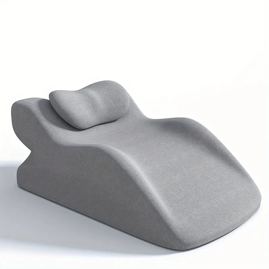 A stomach sleeper pillow designed for lying on your front, shown in blue, dark grey, green, and light grey colour options.