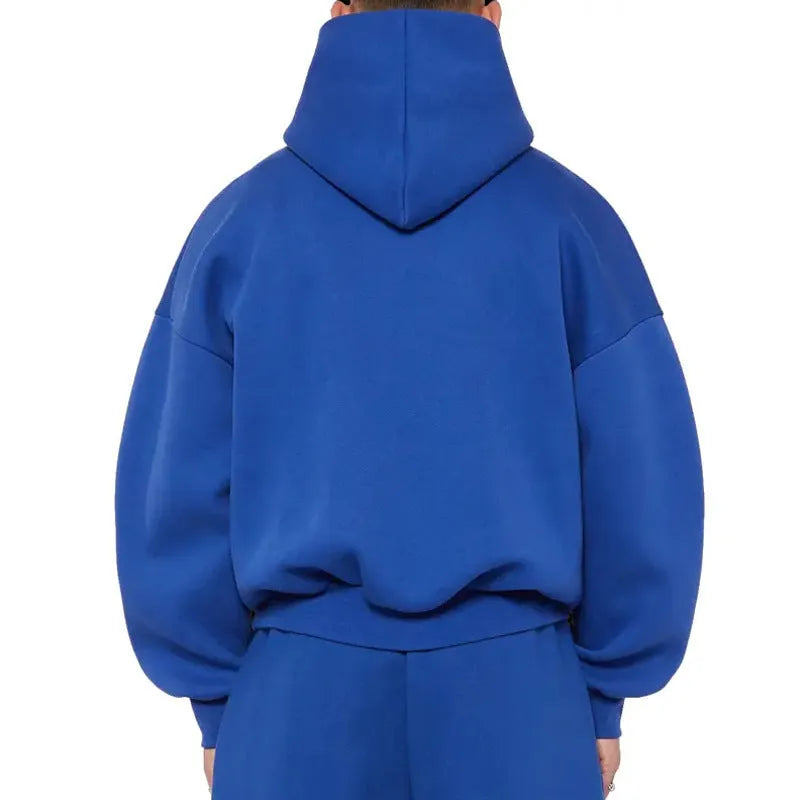 Man wearing a solid colour fleece-lined cotton hoodie sweater with a wool lining.