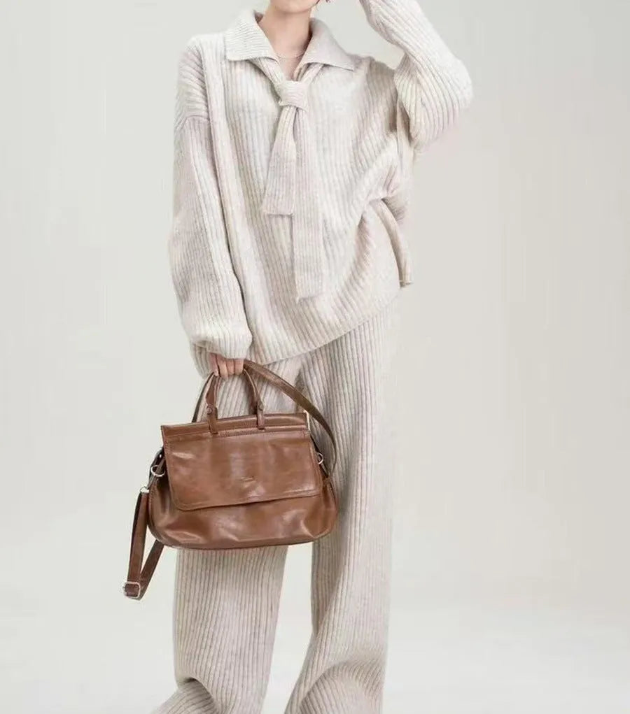 Ladies elegant knit sweater suit two-piece set in imitation cashmere, showing top and trousers in beige.