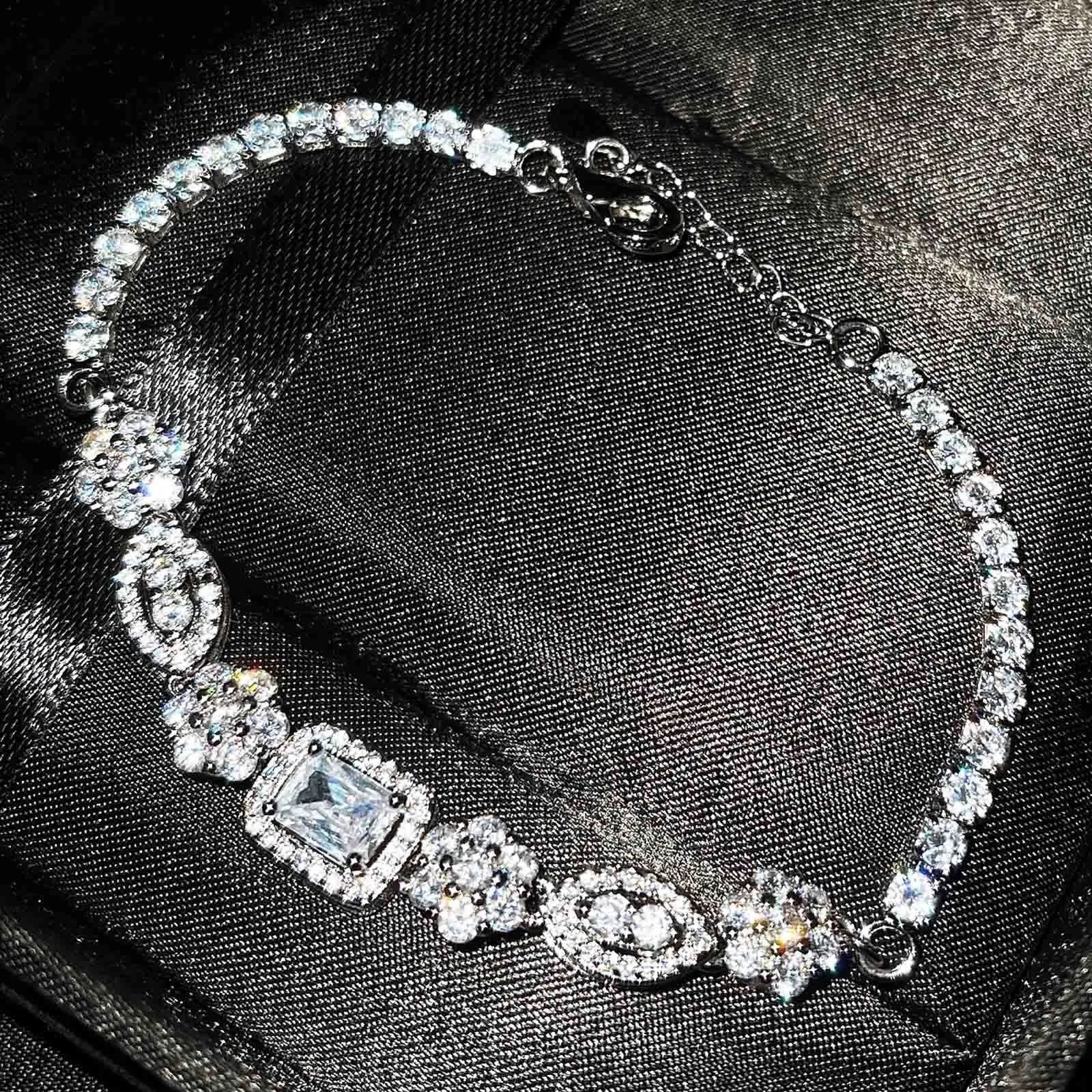 Women's sterling silver-plated bracelet with white gold finish and inlaid zircon stones.