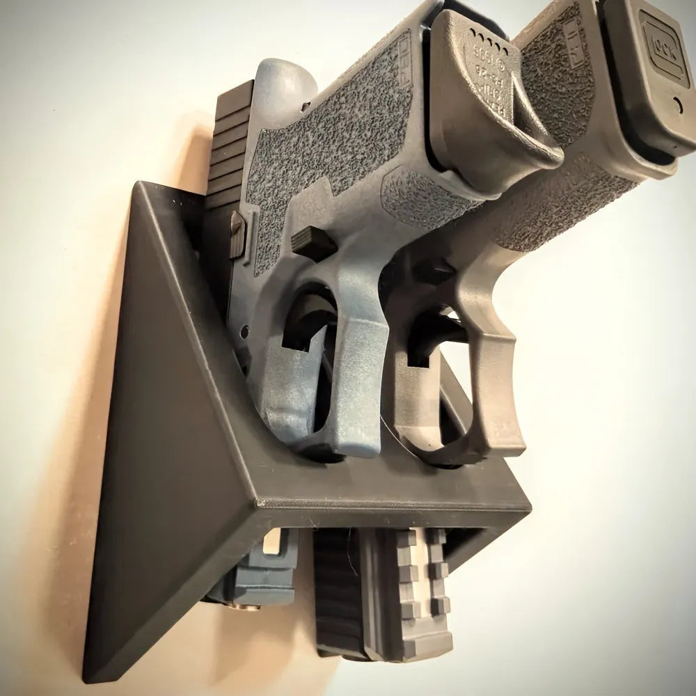 Black punk-style plastic pistol stand for replica firearm display