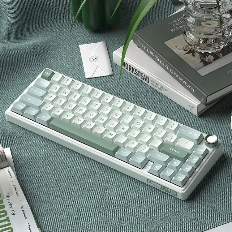 Wireless mechanical keyboard with RGB backlighting in a white colour option on a desk.