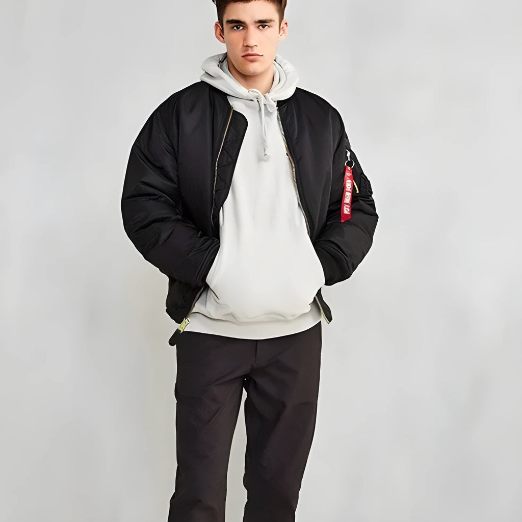 Men's loose fit army green nylon pilot jacket with cotton padding on a mannequin.