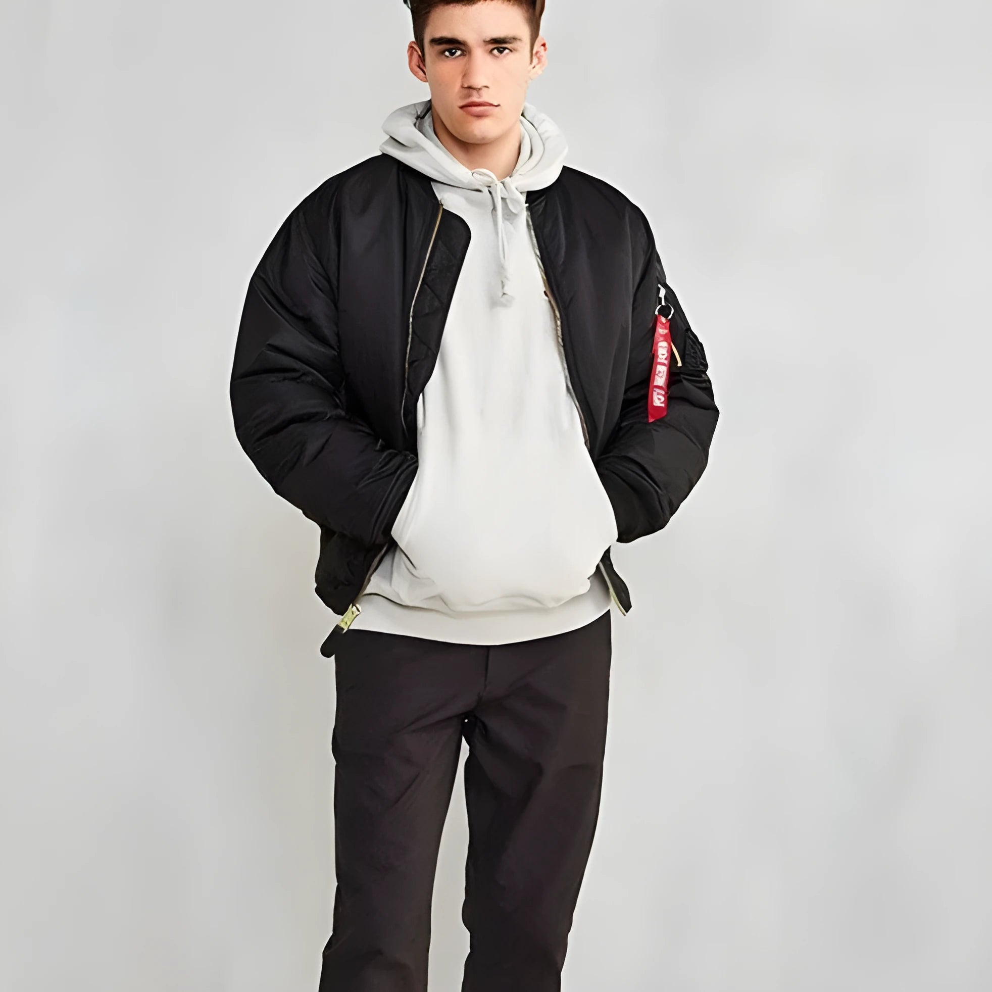 Men's loose fit army green nylon pilot jacket with cotton padding on a mannequin.