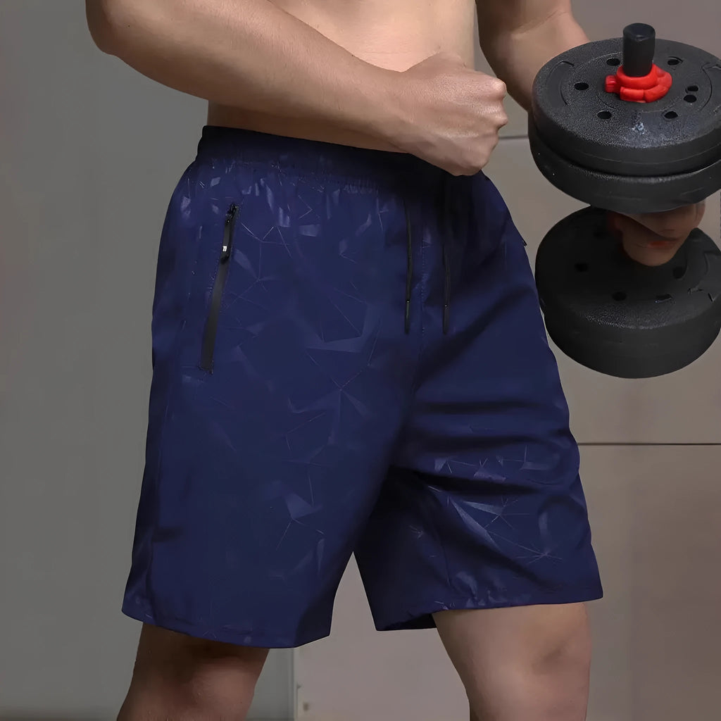 Men's loose-fit sports shorts in polyester with elastic waistband, available in black grey blue colours