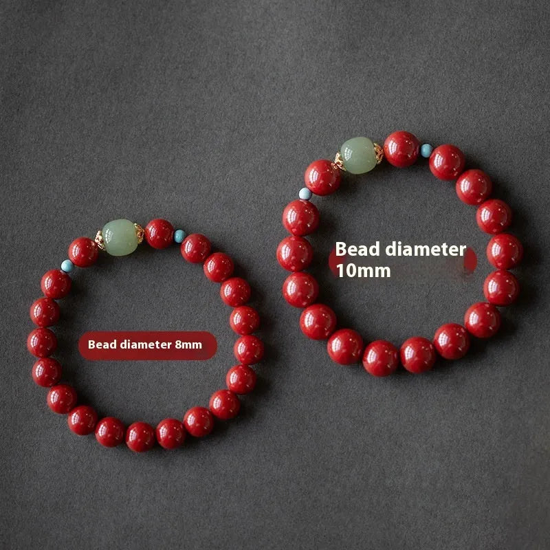 Purple gold sand cinnabar bead bracelet with geometric ellipse shapes on a wrist.