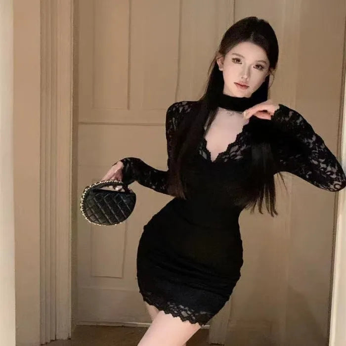 Women's black halter neck lace dress with A-line short skirt and high waist.