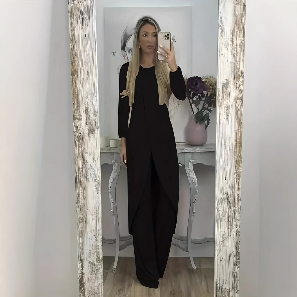 Casual black polyester two-piece lounge set with long sleeve top and loose trousers on a hanger.