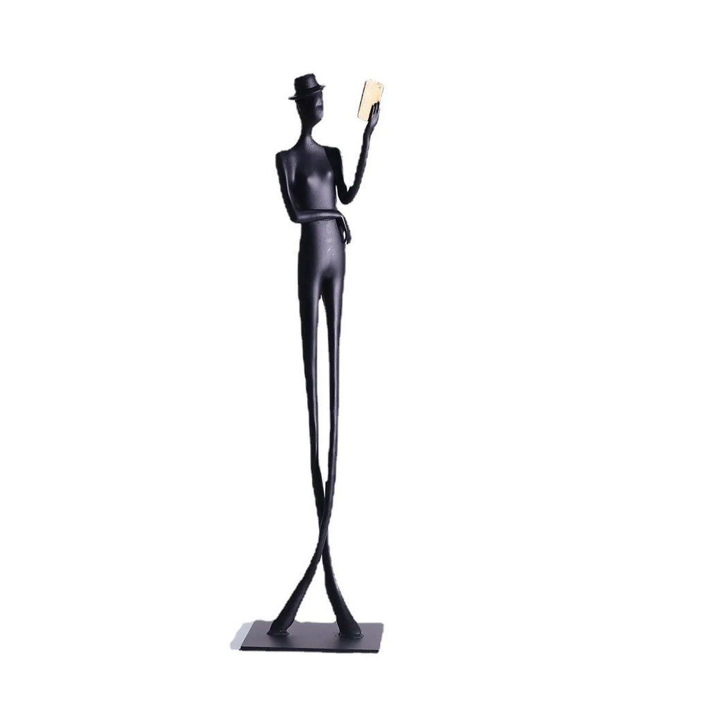 Black cast aluminum modern character desktop sculpture measuring 51cm tall.