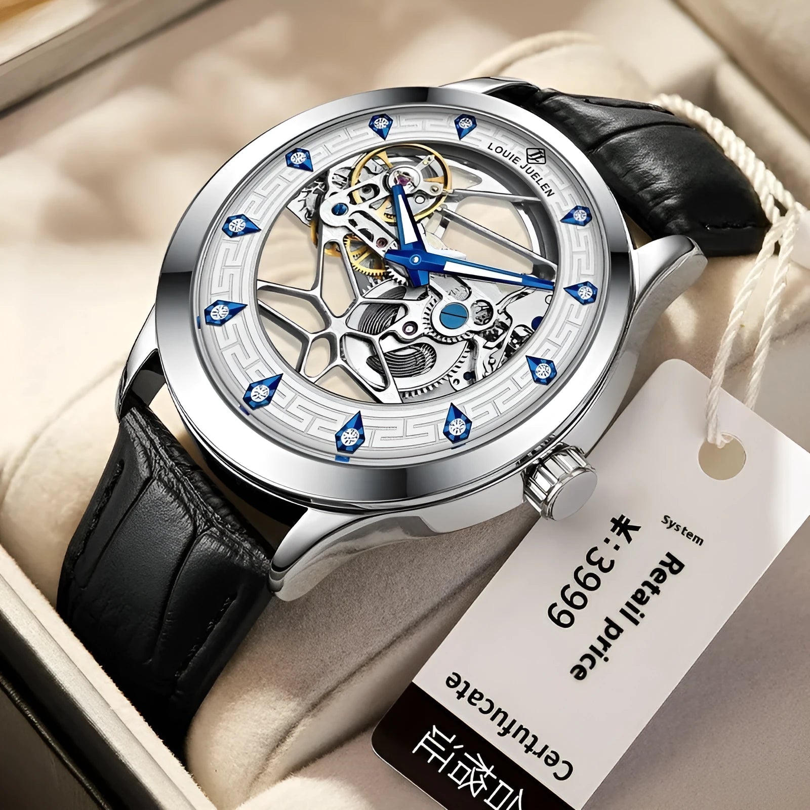 Men's silver mechanical watch with white dial, blue hands, black leather strap, and stainless steel butterfly buckle