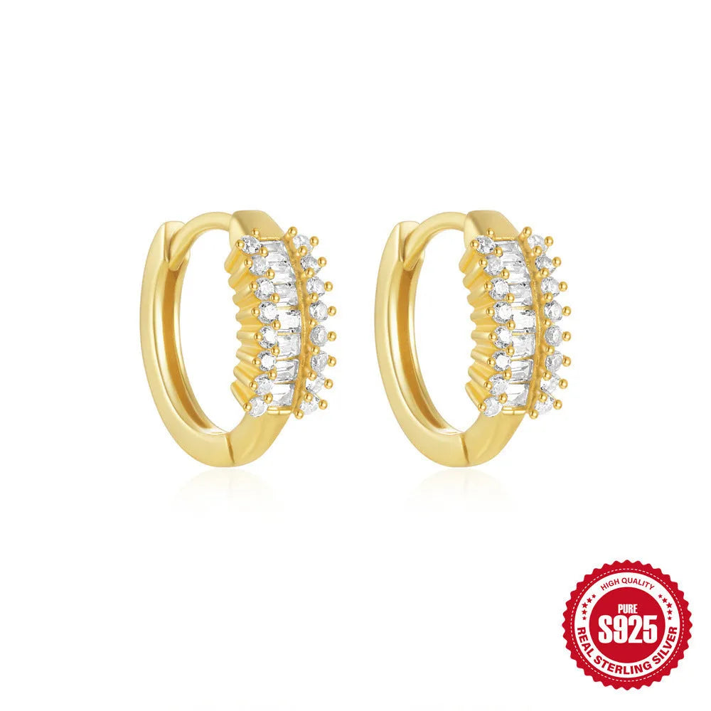 Sterling silver geometric stud earrings with round diamond accents in gold and silver electroplated finishes