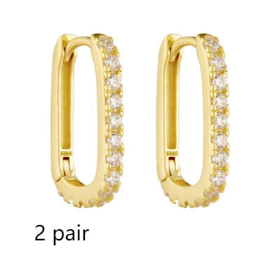Sterling silver oval zircon ear clips with geometric design in white or yellow finish