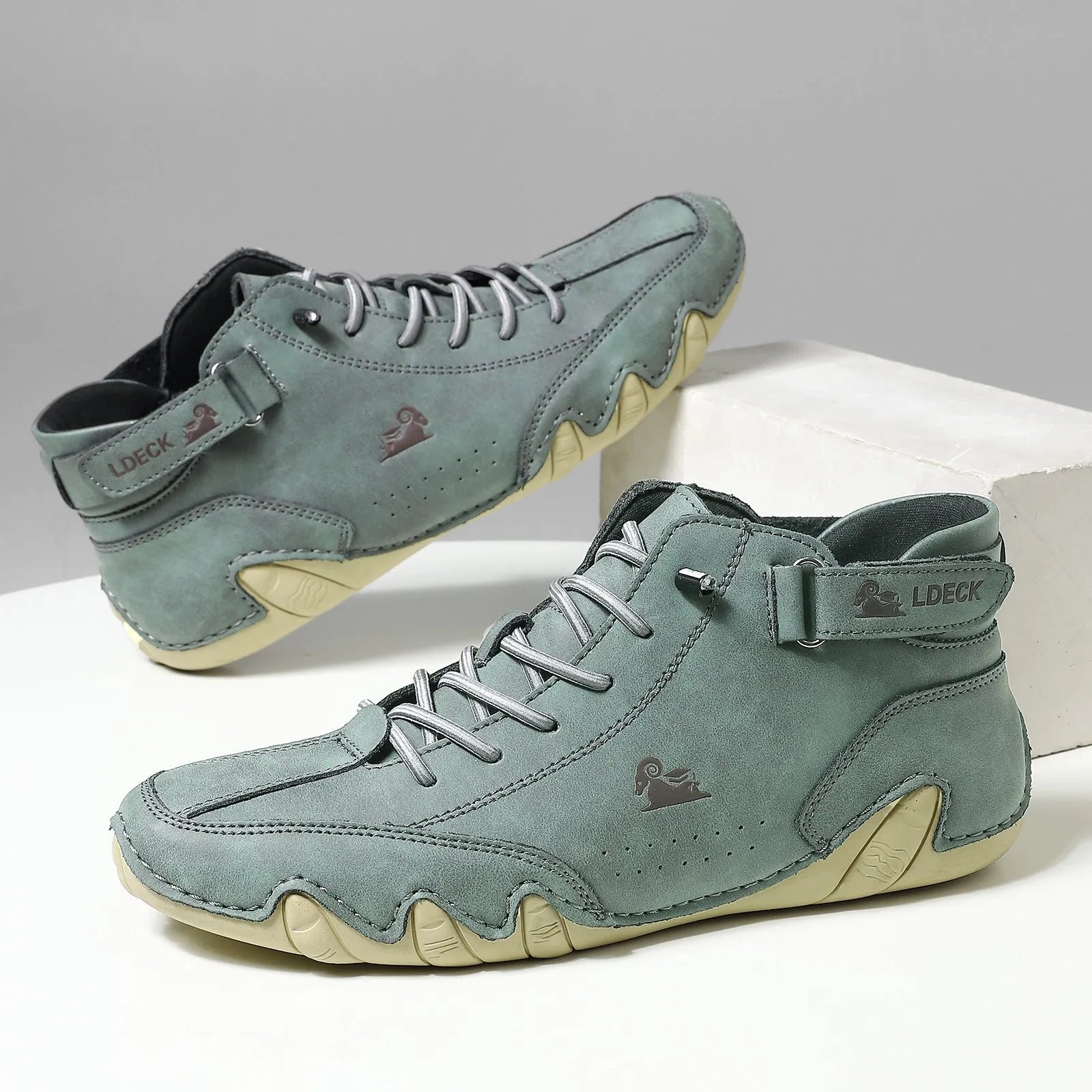 Men's khaki high-top octopus boots with microfiber upper and rubber sole shown on a white background
