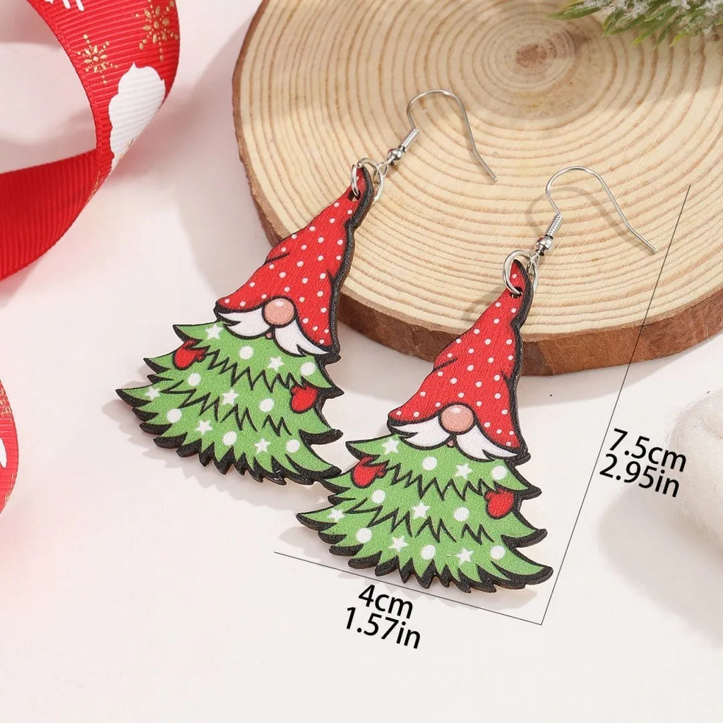 Wooden Christmas earrings with geometric tree and snowman designs featuring Santa Claus elements