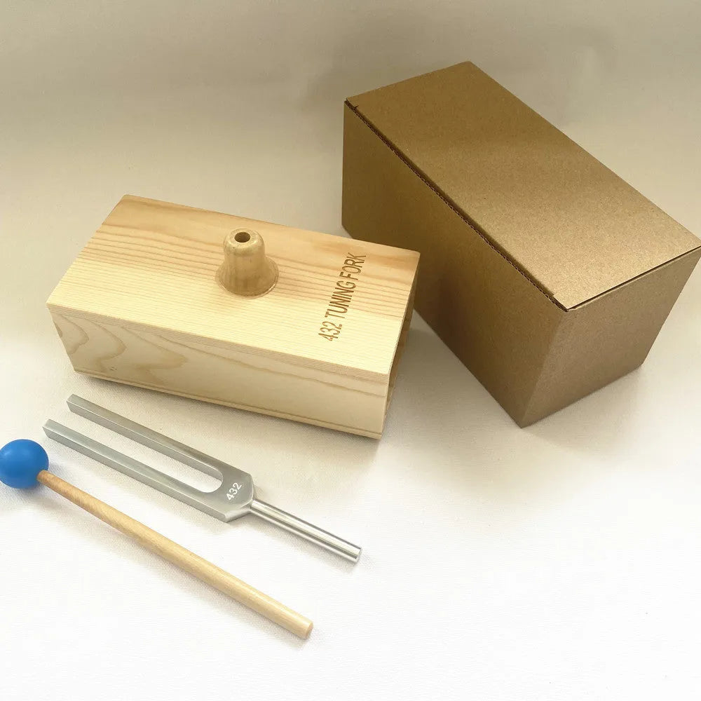 Aluminium alloy 432Hz tuning fork with acoustic speaker on kraft paper background