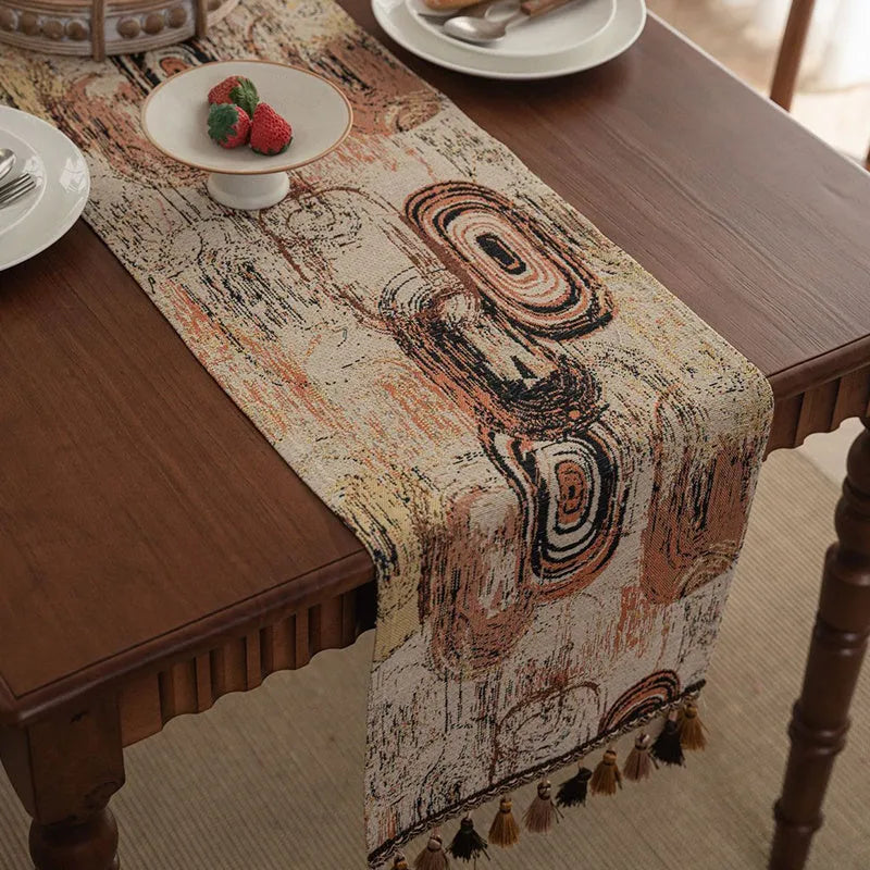 Nordic jacquard bouquet pattern table runner with decorative tassel trim in dark blue colour