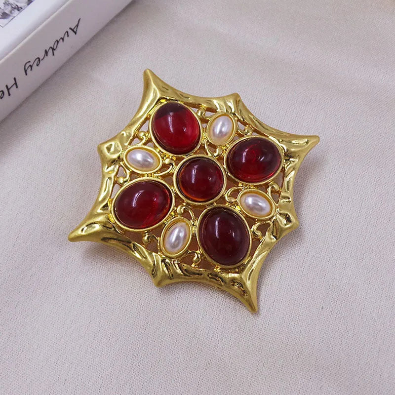 Medieval baroque crystal cross brooch in zinc alloy with ornate design on dark background