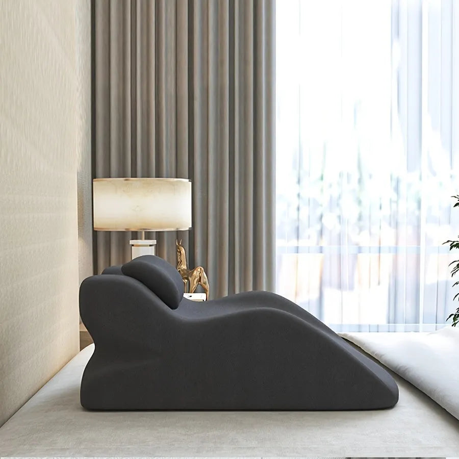 A stomach sleeper pillow designed for lying on your front, shown in blue, dark grey, green, and light grey colour options.