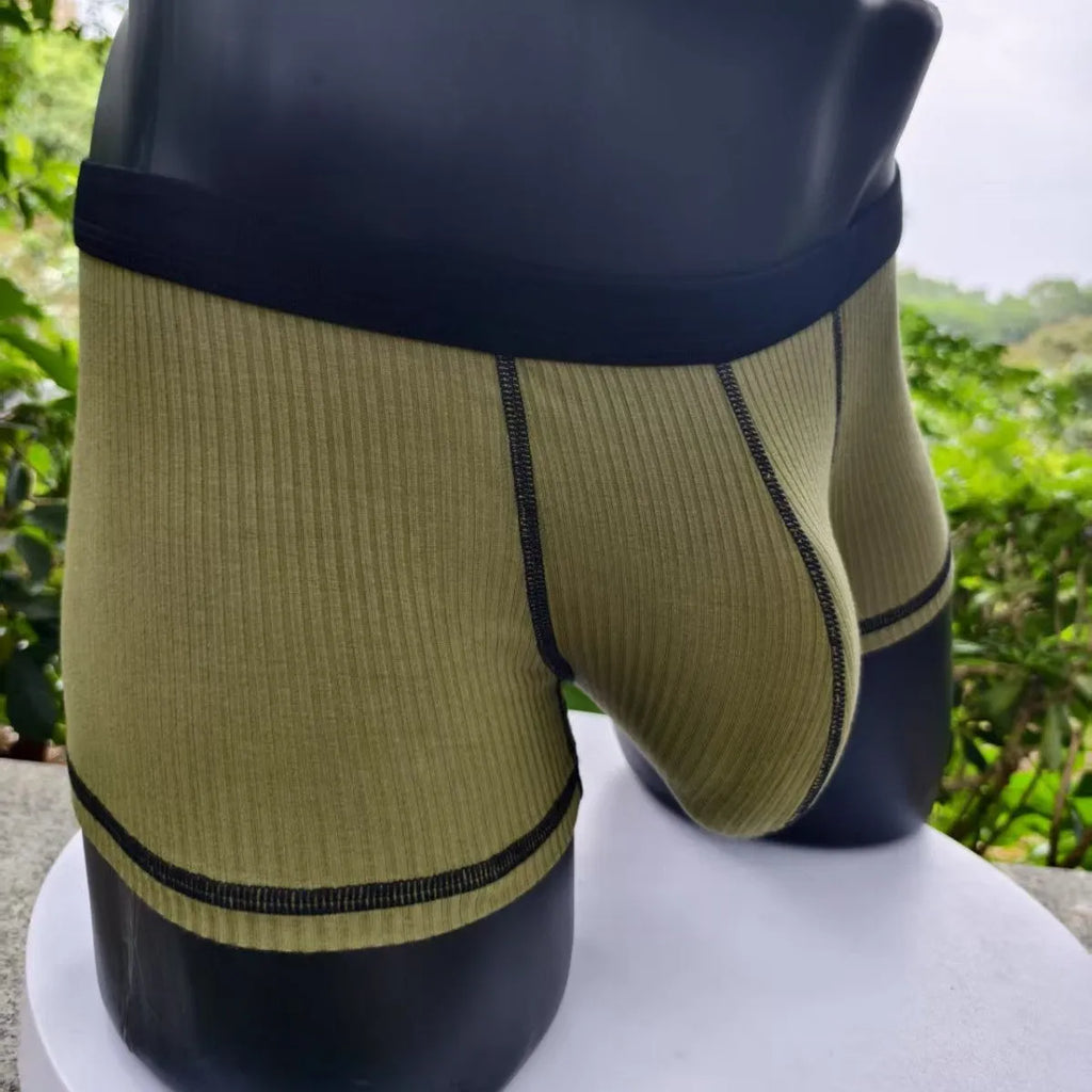 Men's solid colour breathable fibre boxer shorts shown in army green, demonstrating thin fabric and fit.