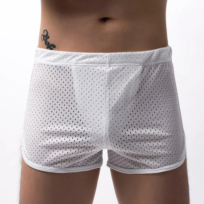 Men's knitted cotton three-point boxer shorts in black, grey, blue, and white colours laid flat.