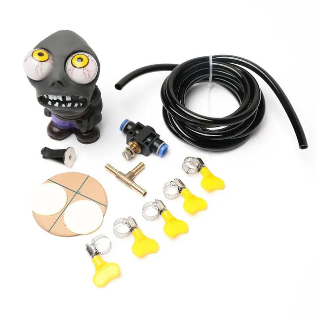 Turbo car Explosive Eye Doll ornament kit with pressure valve, copper tube, and mounting clip on a car dashboard vent.