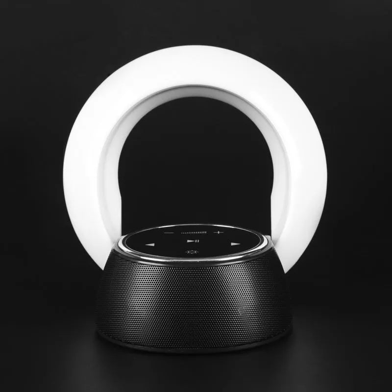 Blue folding Bluetooth speaker desk lamp with touch controls showing white, yellow, and blue LED lighting options