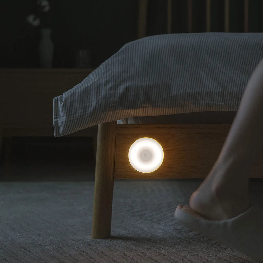 White Mijia Night Light 2 Bluetooth bedside lamp with human body induction on a table.