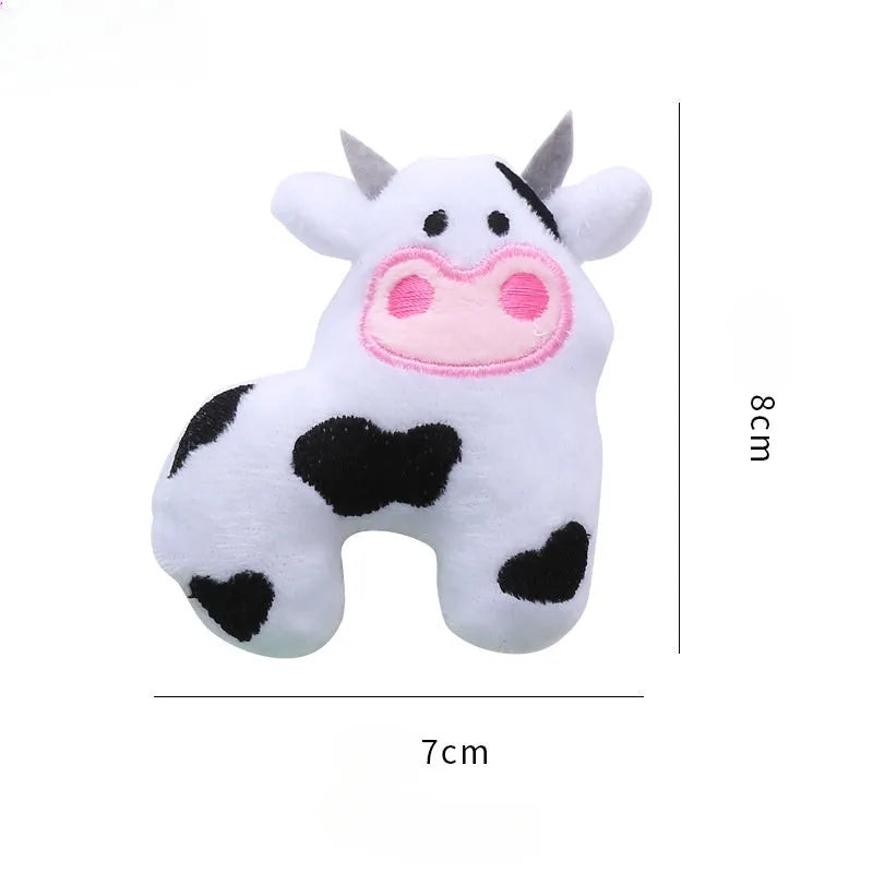 Plush cat toy in the shape of a cow, filled with catnip for interactive play with pets.