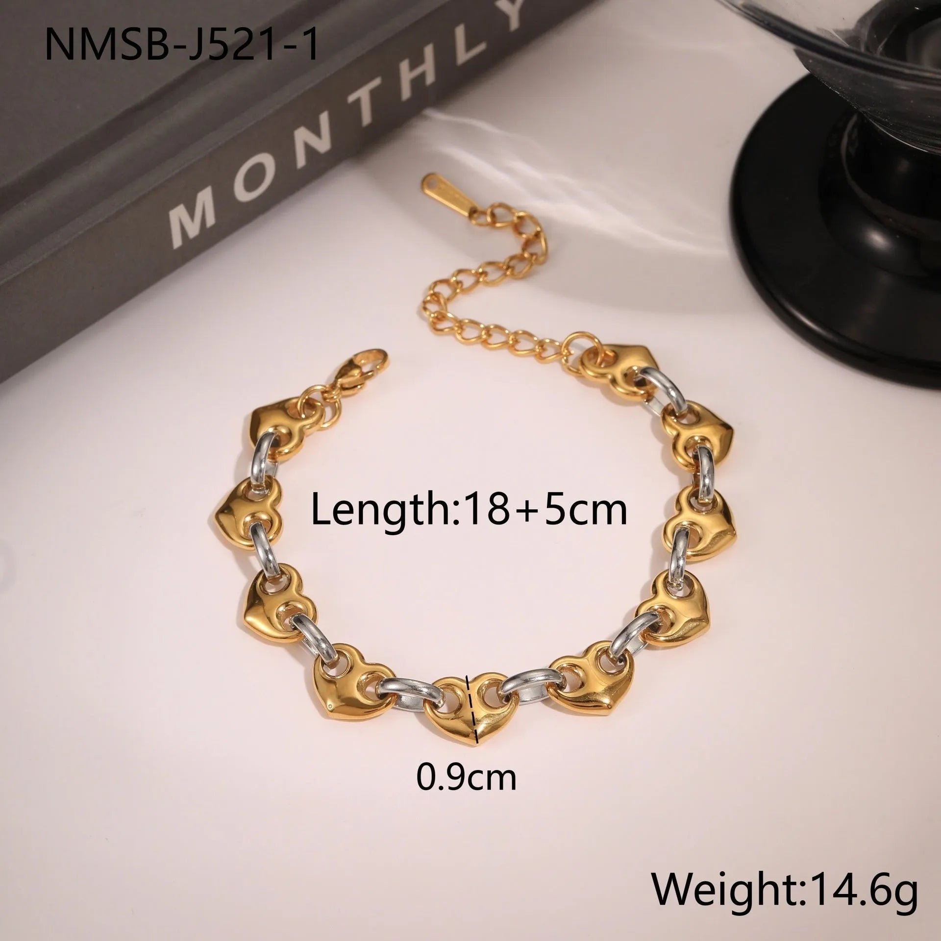Stainless steel women's bracelet with a hollowed-out heart charm in gold or steel colour.