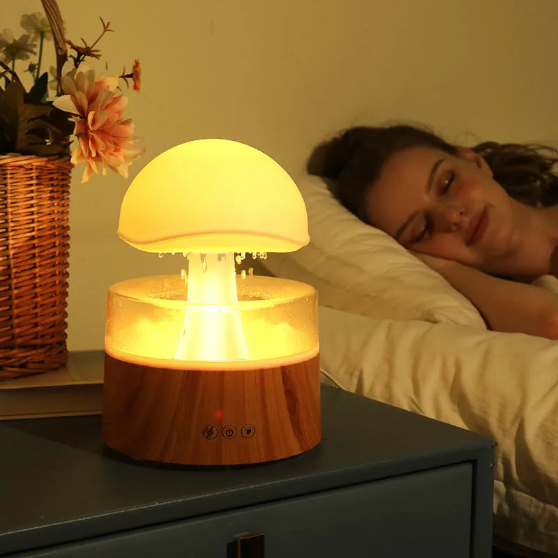 White cloud-shaped ultrasonic humidifier and aroma diffuser with colourful lighting and simulated raindrops
